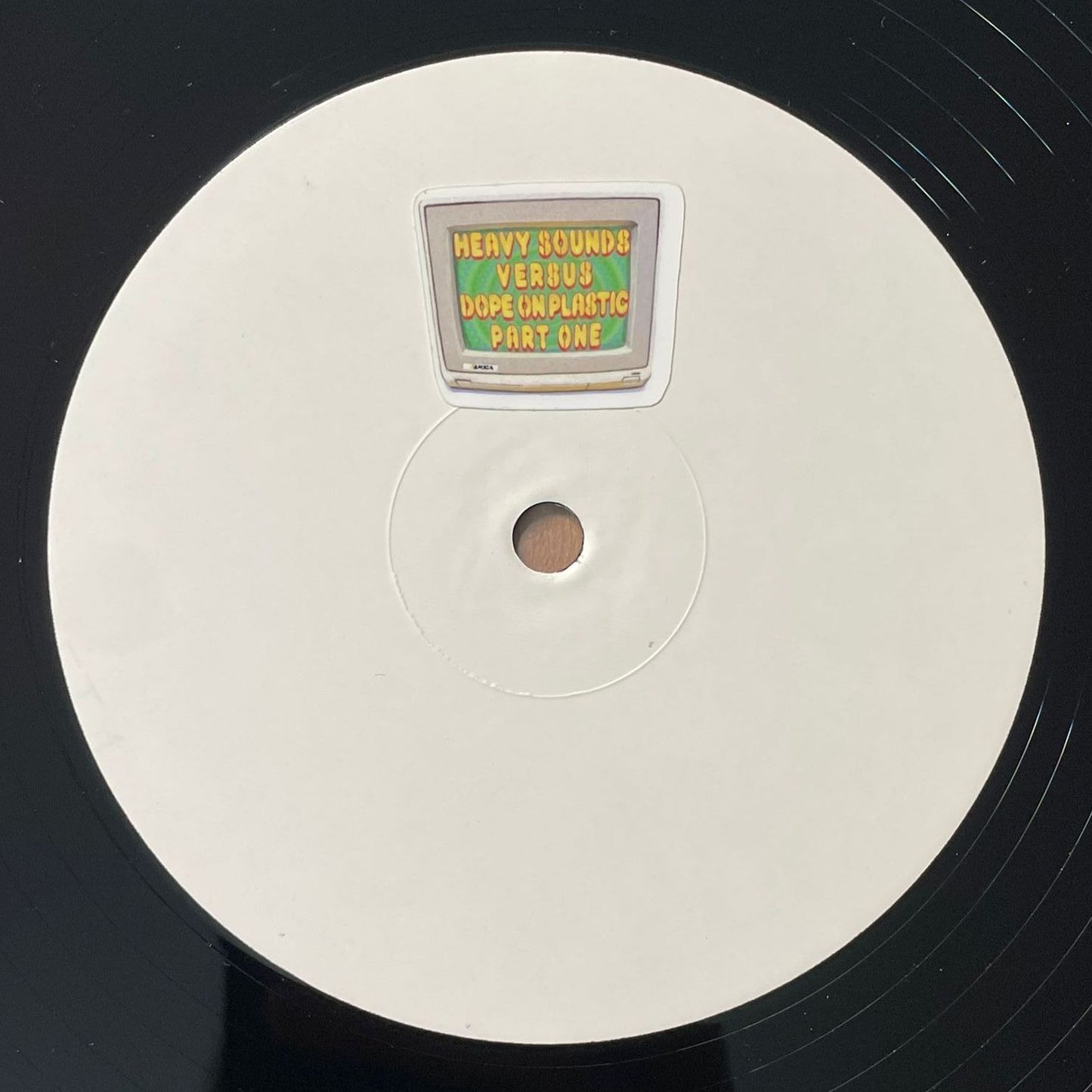 label of Dope On Plastic & Quaad - Heavy Sounds Versus Dope On Plastic Part One - 12" vinyl release on Heavy Sounds