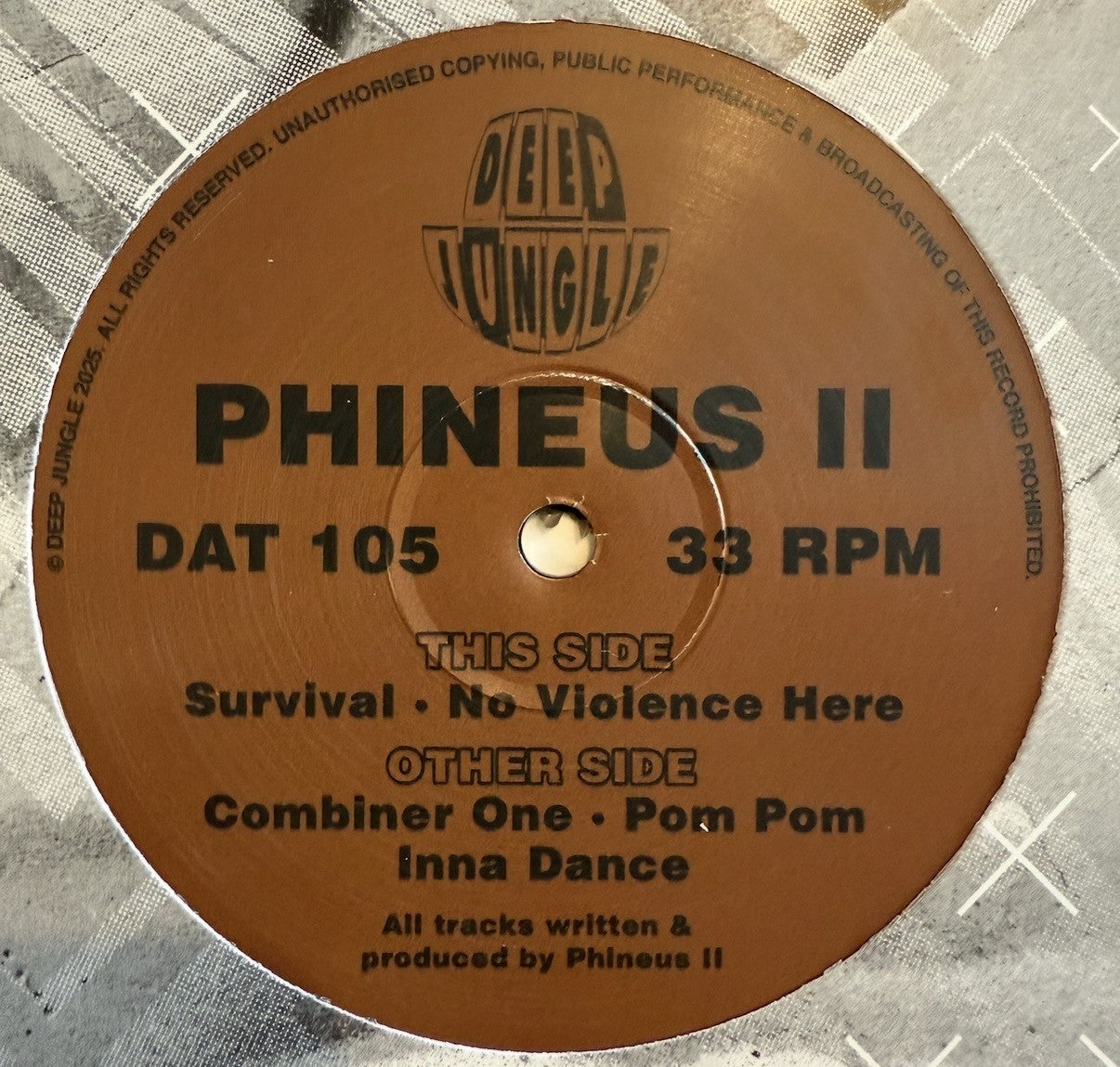 Brown vinyl record label with text on a textured surface