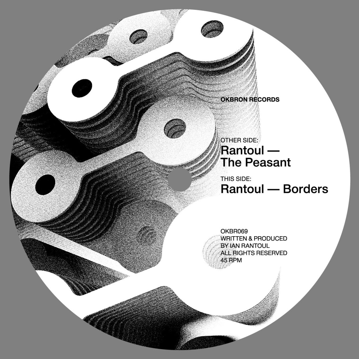 Black and white vinyl record label with text and abstract design on a gray background