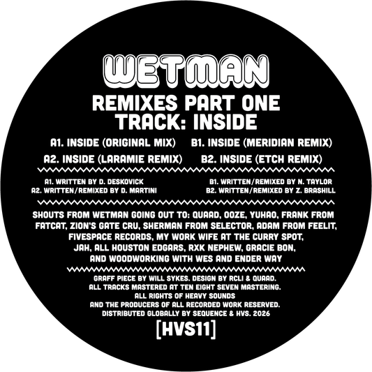 Vinyl record label with text for 'Wetman Remixes Part One' featuring tracklist and credits.