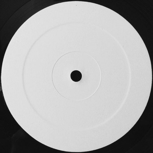 White vinyl record with a black center on a black background