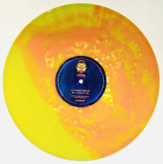 Vinyl record with a colorful marbled design and a blue label on a white background